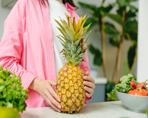 A beautiful composition of fresh tropical fruits on a bright sunny kitchen counter